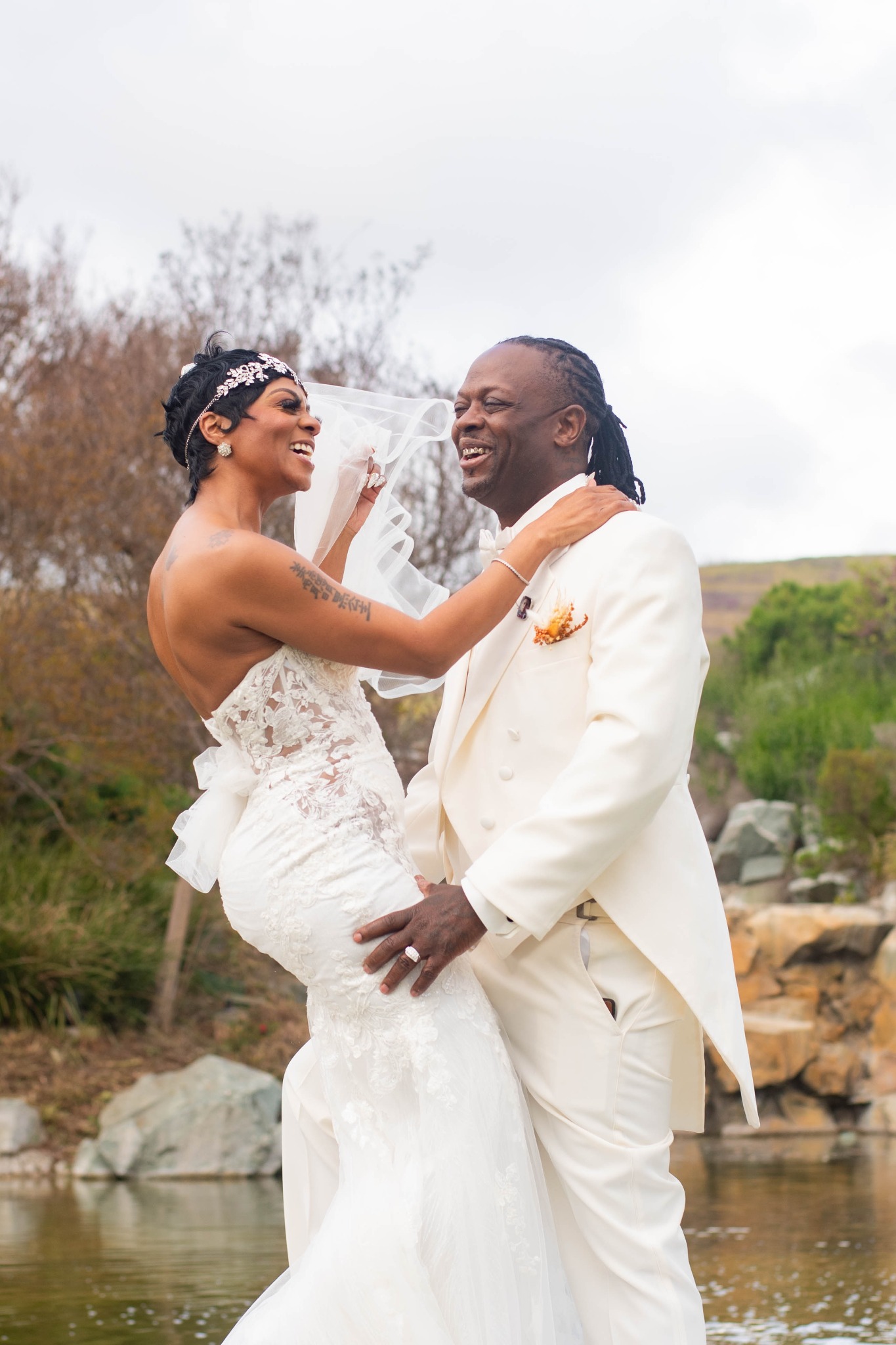 Barron and Janell smiling together on their wedding day